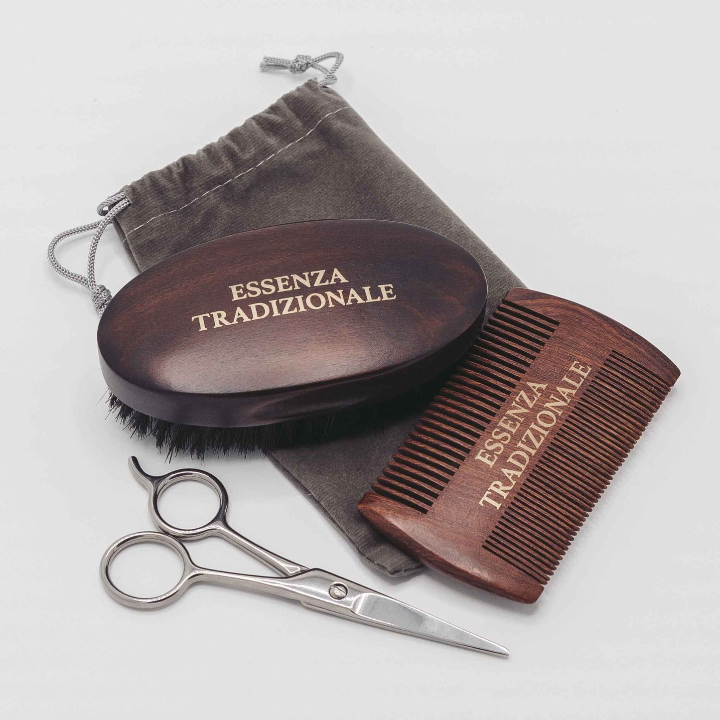Wooden grooming set with brush, comb, and scissors on a white background