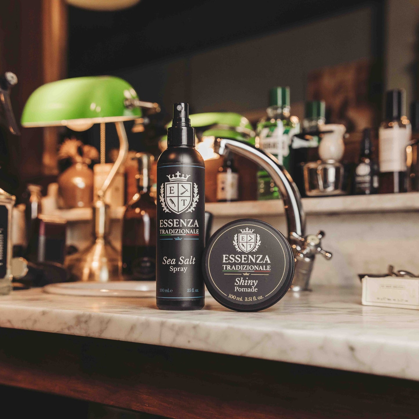 Two bottles of Esseenza Tradizionale on a bar counter with a blurred background