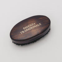 Wooden brush with black bristles and 'Essenza Tradizionale' branding on a white background